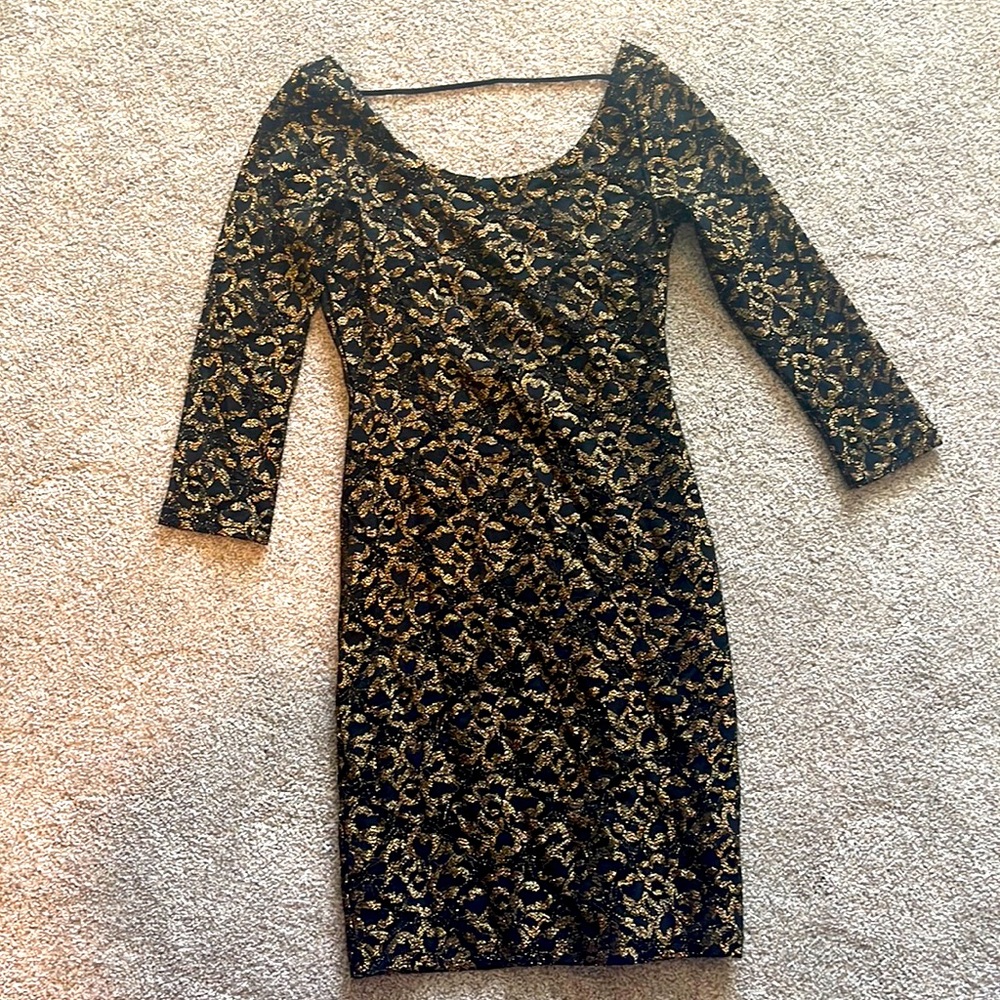 Beautiful gold and black women’s dress with unique back